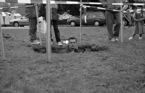 Participant experiencing the ground-level perspective by standing inside the dug-out installation.